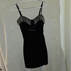 Black velvet dress with bust detailed in jewele strings.